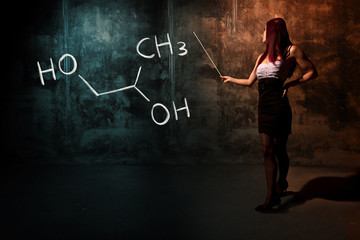 Sexy girl or secretary or female student presenting handdrawn chemical formula of propylene glycol -1,2