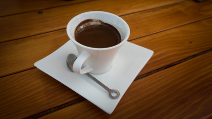 Cup of coffee on a wooden table