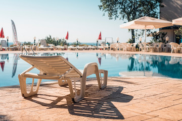 Chaise lounge by the pool. Summer holidays