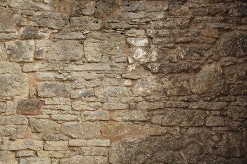rough sandy texture of an old medieval stone wall. Background for design, close-up, copy space