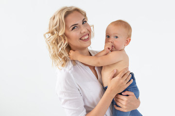 Happy mother with adorable baby on white background