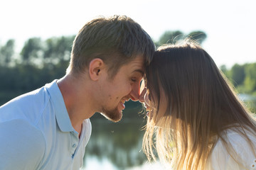 Fototapeta premium happy romantic couple in love and having fun outdoor in summer day, beauty of nature, harmony concept