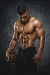 Fototapeta na wymiar Strong, Shirtless American Football Player