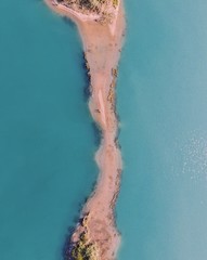 Drone shot over gravel lake