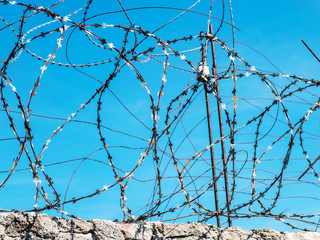 Fragment of barbed wire mounted above prison fence, Rummu quarry, Estonia