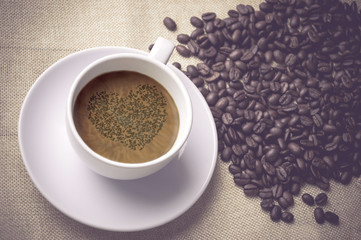 cup of coffee on linen napkin