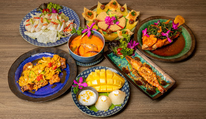 Thai food on the wooden board.