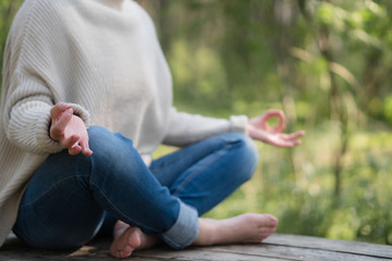 Adult woman meditation in the forest on nature.