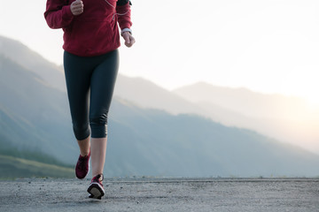 Shot of a beautiful adult woman training at sunrise.