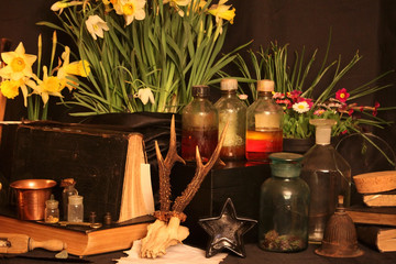 Witchcraft Peacock feathers and candle background.