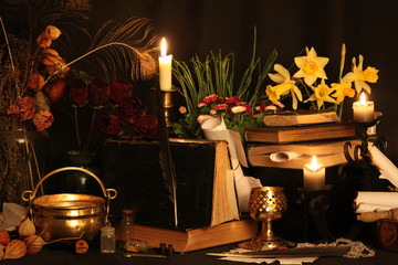 Witchcraft Peacock feathers and candle background.