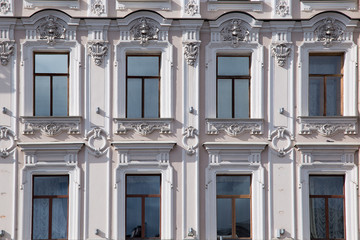  windows and details on an exterior of the building.