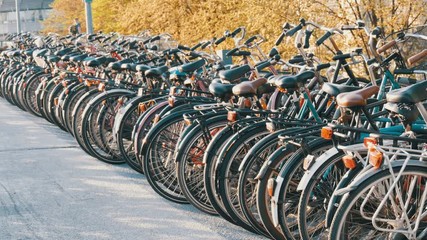 Amsterdam, Netherlands - April 21, 2019: Parking for bicycles. Many different bicycles parked on the street in special parking lots. The problem of bicycle overload in the country