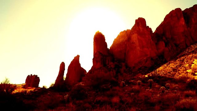 Hot Sun Over Rocky Peak Slow Zoom