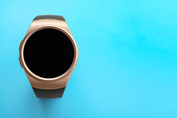 Trendy smart watch on light blue background, top view. Space for text