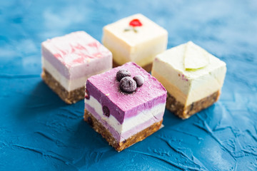 Homemade raw cakes with fresh berries and nuts. healthy vegan food concept, close up