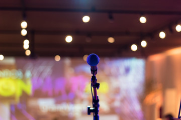 Microphone stand on the stage with blurry background