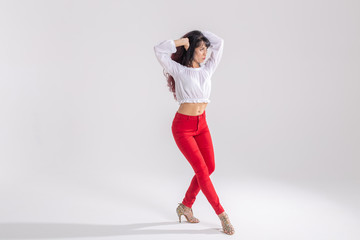 Latino dance, Improvisation, contemporary and vogue dance concept - young beautiful woman dancing on white studio background