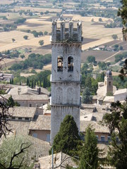 mazing view from the hill to the old tower of the medieval town of Assisi. Italy, August 2012