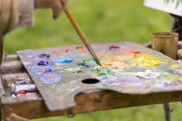 Drawing with oil paints on the nature. Wonderful hobby