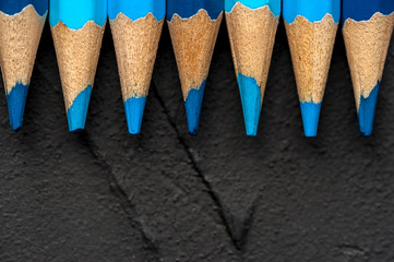 Close-up bright sharpened pencils of blue shades