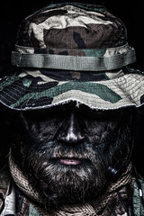 Commando soldier in boonie hat close up portrait