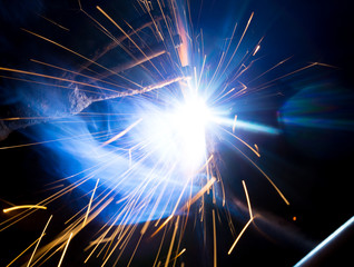 Welding sparks and smoke worker robot