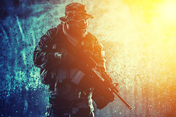 Commando fighter with rifle sneaking in darkness