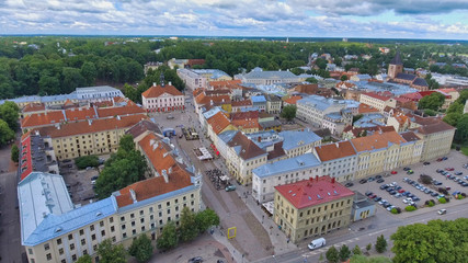 Fototapeta na wymiar Aerial view of Tartu skyline on a cloudy summer day