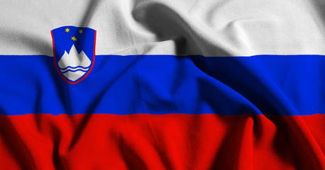 National flag of Slovenia on a waving cotton texture background
