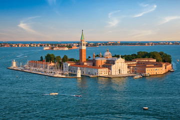Fototapeta na wymiar Aerial view of Venice lagoon with boats and San Giorgio di Maggiore church. Venice, Italy