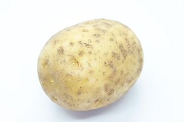 Ripe Potato Tuber located on a white background