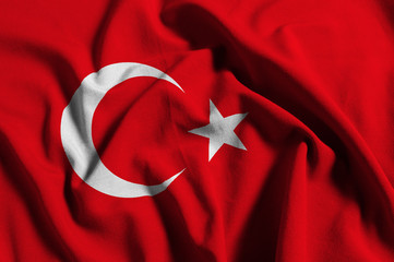 National flag of Turkey on a waving cotton texture background