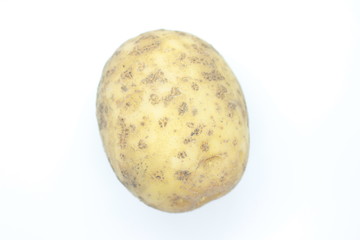 Fototapeta premium Ripe Potato Tuber located on a white background