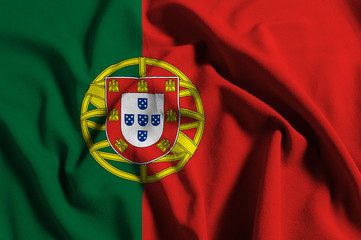 National flag of Portugal on a waving cotton texture background
