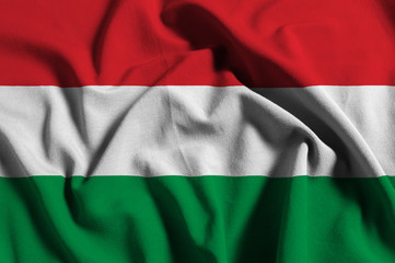 National flag of Hungary on a waving cotton texture background