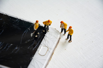 figurine model repair mobile crash with repairman