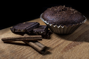 Chocolate muffin with cinnamon filling on cutting board