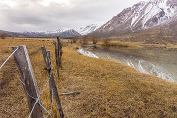 Scene view of an overcast day against snow-capped mountains during winter season in Patagonia,...