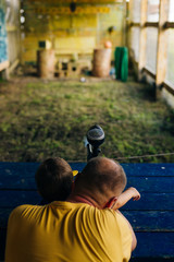 dad and son at shooting range