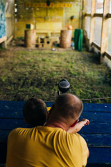 dad and son at shooting range