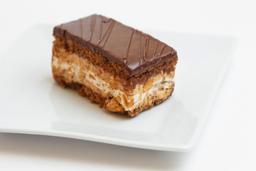 piece of cake on a plate on white background