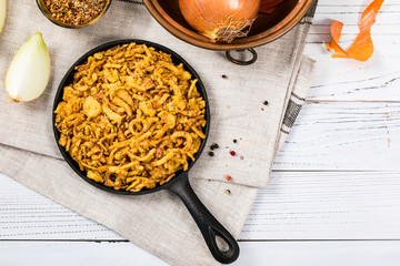 Crispy Fried Onion Strings Background. Selective focus.