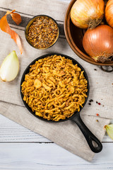 Crispy Fried Onion Strings Background. Selective focus.