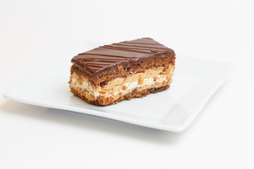 piece of cake on a plate on white background