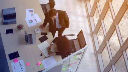 Office working from top view diversity workers African and Hispanic business team