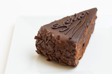piece of cake on a plate on white background
