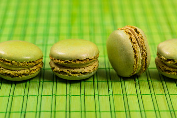 Green Pistachio Macaron Cookies Background. Selective focus.