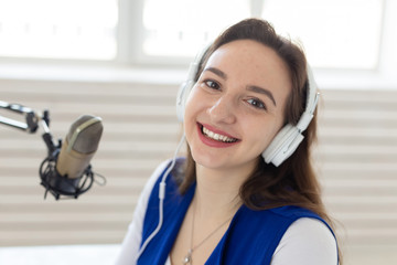 Radio host concept - Portrait of woman radio presenter with headphones