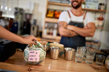 Tips jar - Money left for employee in cafe store..